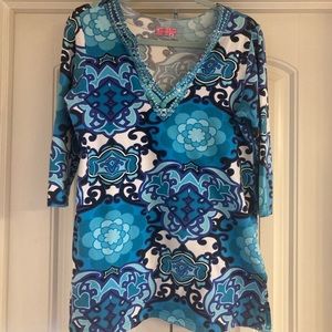 Ladies blue print tunic with beading at neck.